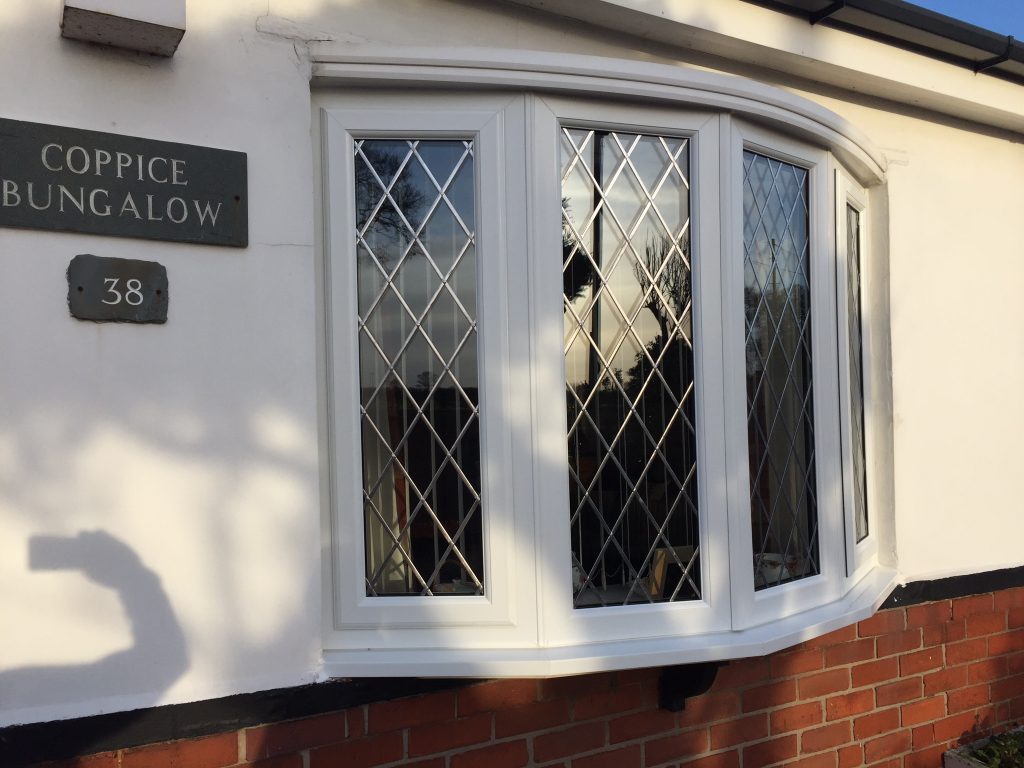 Completed white uPVC bow window with leaded diamond glazing on a bungalow in the Doncaster area